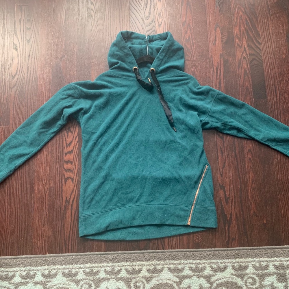 Teal fleece hooded sweater.